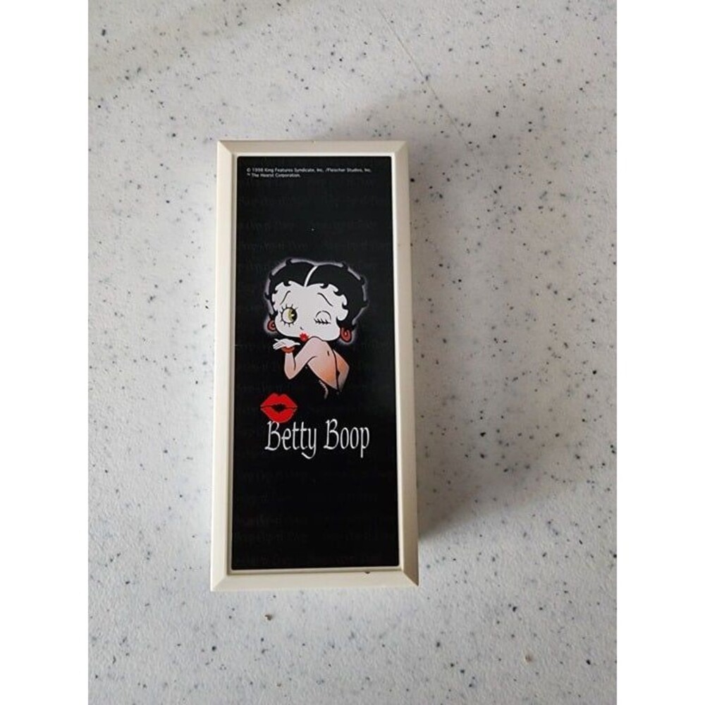 Betty Boop wristwatch featuring a round dial with Betty Boop over a red heart ba